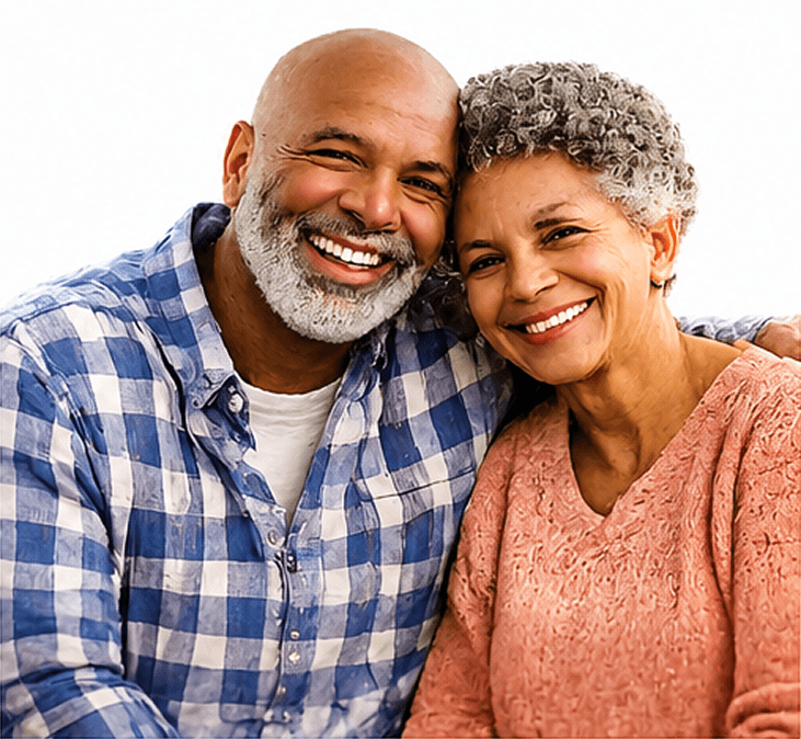 A smiling middle-aged couple with gray hair posing closely together.